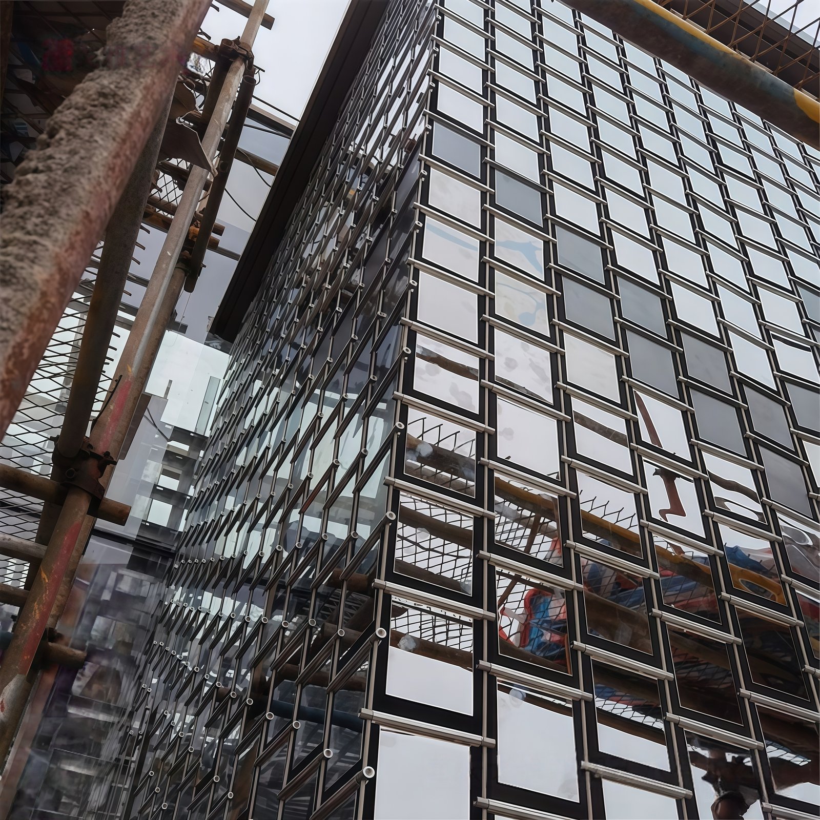 Building facade renovation using a lightweight wind-activated shimmer wall system by Youjia.