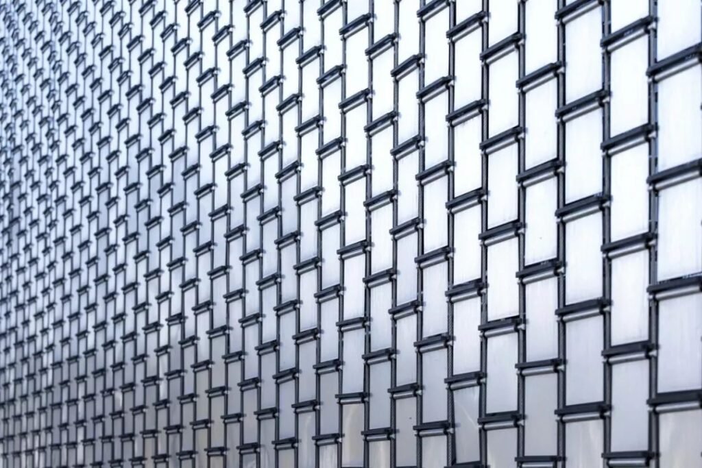 Dynamic facade wall art sculpture using stainless steel pulleys and rigging hardware