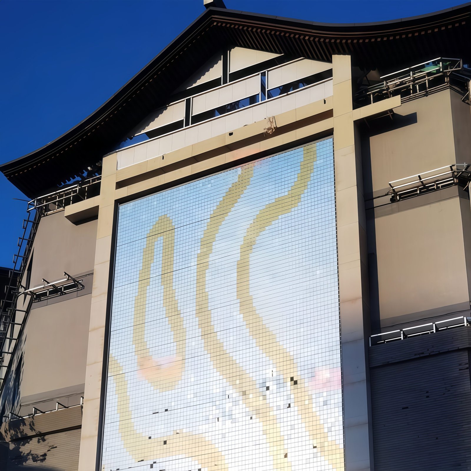 Custom blue and purple PVD coated stainless steel wind panels for a vibrant shimmer wall effect.